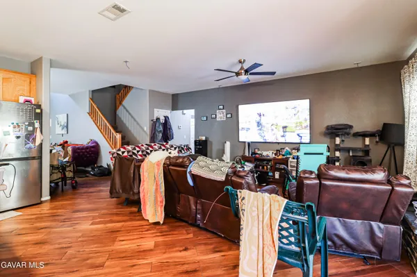 a living room with lots of furniture and a flat screen tv