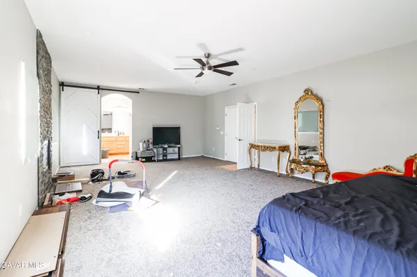 a bedroom with a bed and a cabinets