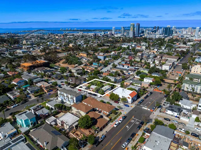 an aerial view of residential building with parking