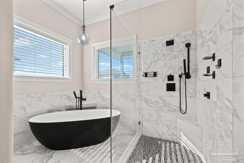 321 Gulfview Lane Perdido Key, FL 32507 - Photo 25 of 57 a bathroom with a tub a mirror and shower