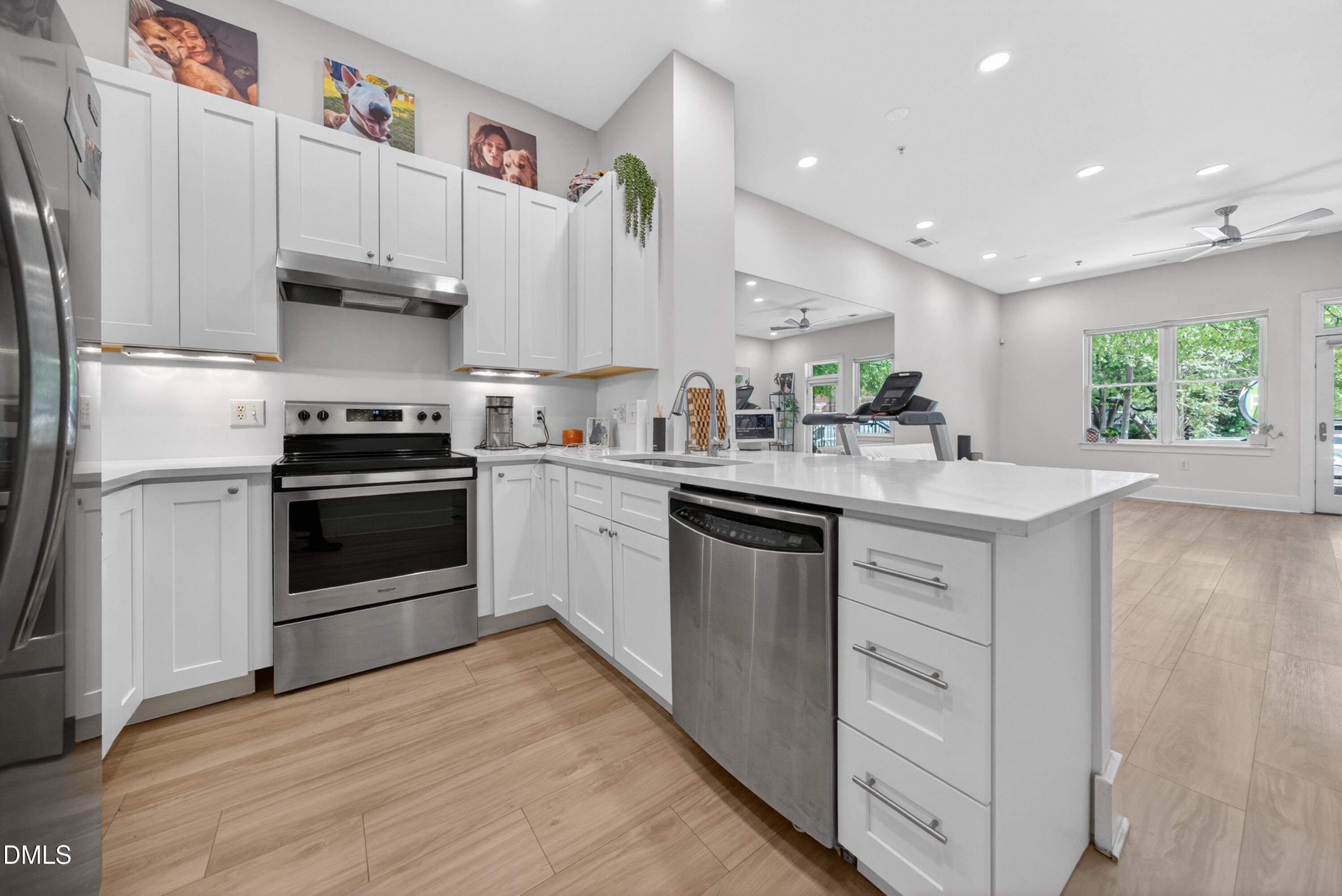 444 South Blount Street, Unit 111 Raleigh, NC 27601 - Photo 22 of 40 a kitchen with a sink white cabinets and white appliances
