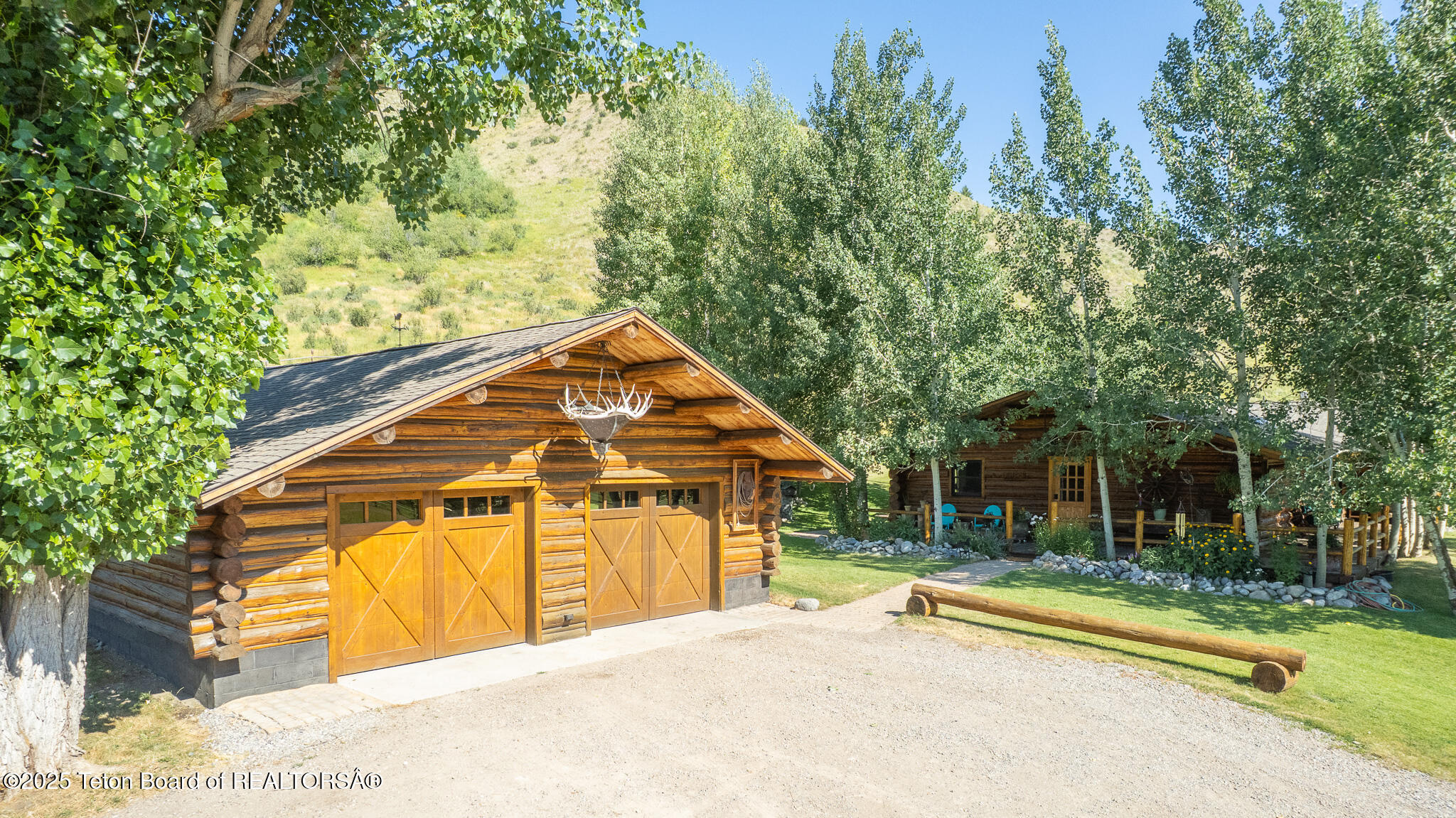 9375 Cole Canyon Road Jackson, WY 83001 - Photo 32 of 39 Garage + house exterior