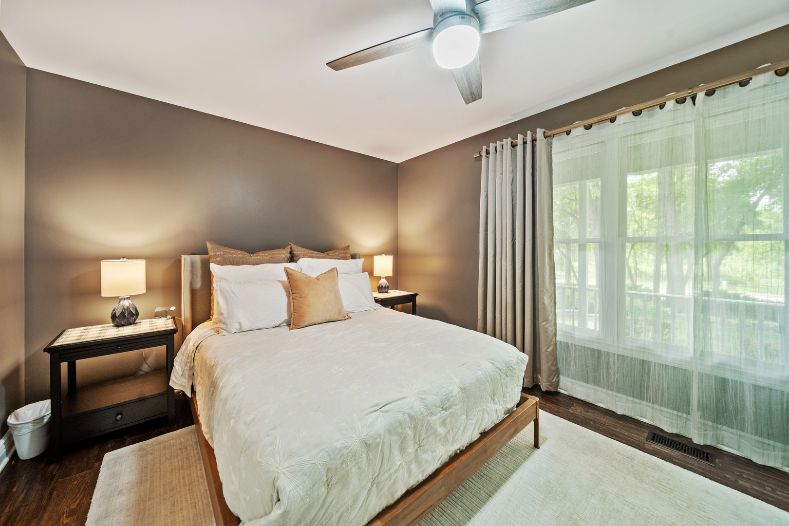 28W140 Mack Road Wheaton, IL 60189 - Photo 30 of 48 a bedroom with a balcony a bed and a chandelier