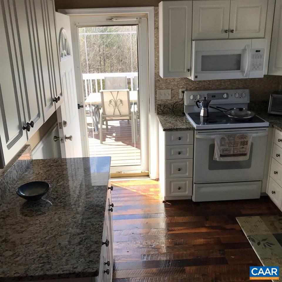 6845 Cabell Road Howardsville, VA 24562 - Photo 14 of 49 a kitchen with stainless steel appliances granite countertop a stove a sink and a microwave