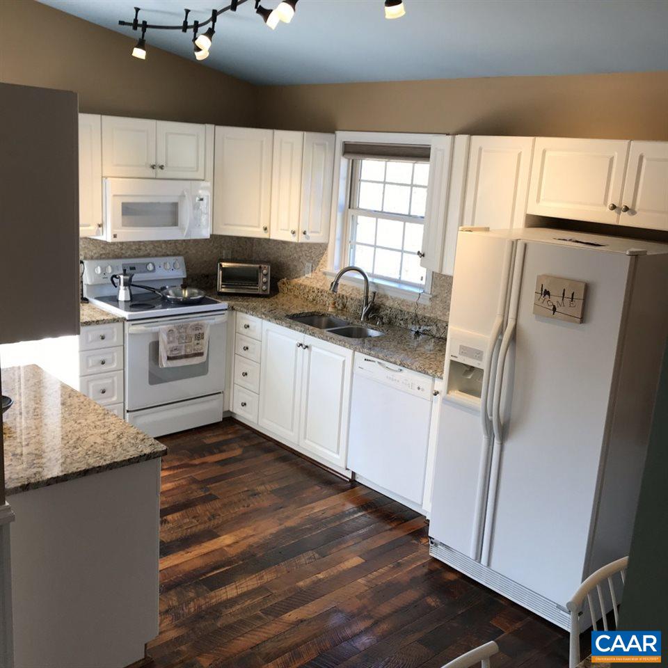 6845 Cabell Road Howardsville, VA 24562 - Photo 15 of 49 a kitchen with granite countertop a sink cabinets stainless steel appliances and a window