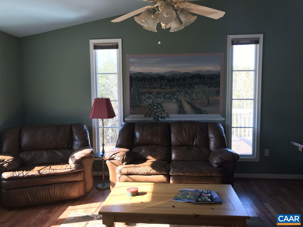 6845 Cabell Road Howardsville, VA 24562 - Photo 17 of 49 a living room with furniture and a fireplace