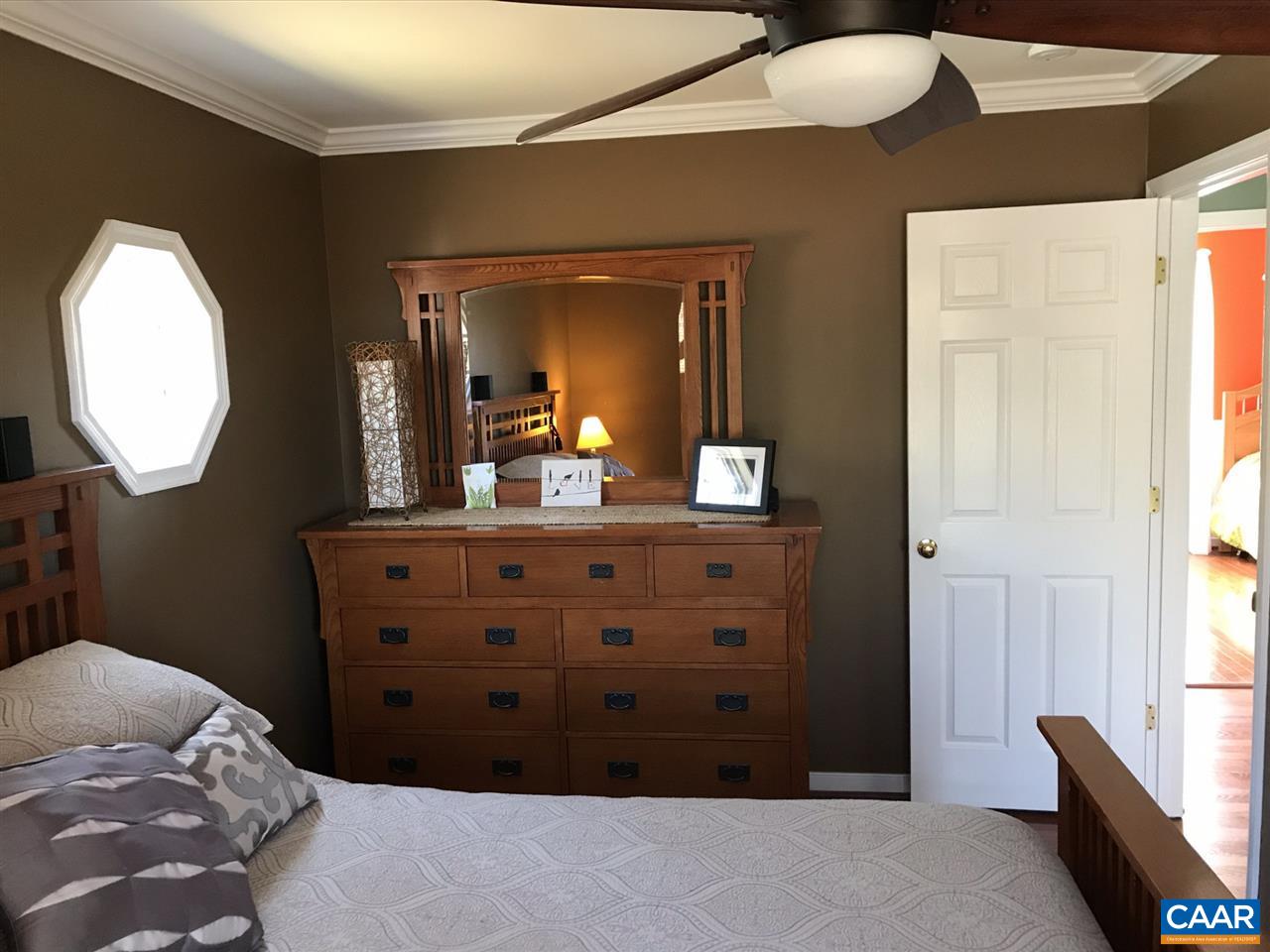 6845 Cabell Road Howardsville, VA 24562 - Photo 22 of 49 a bedroom with a bed and a mirror