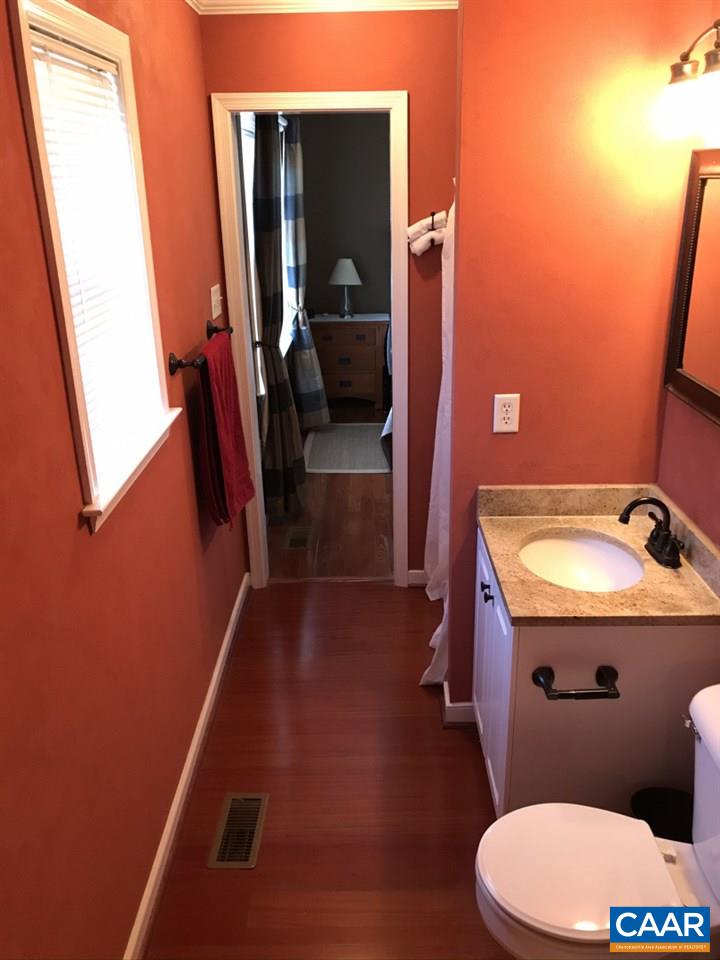 6845 Cabell Road Howardsville, VA 24562 - Photo 24 of 49 a bathroom with a sink and a mirror