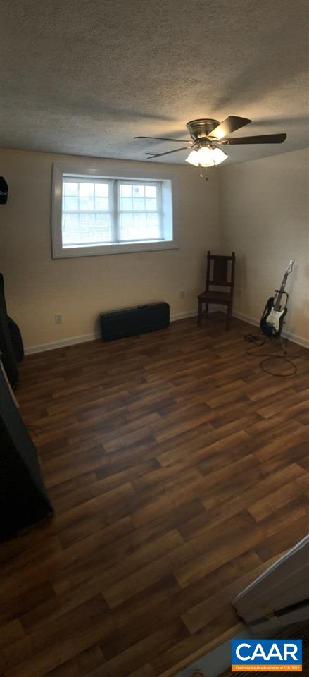 6845 Cabell Road Howardsville, VA 24562 - Photo 37 of 49 a view of a room with wooden floor and staircase