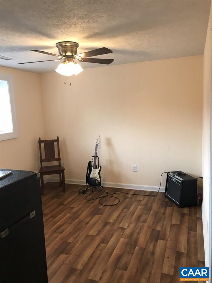 6845 Cabell Road Howardsville, VA 24562 - Photo 38 of 49 a view of a room with wooden floor and ceiling fan