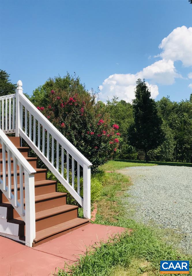 6845 Cabell Road Howardsville, VA 24562 - Photo 5 of 49 a view of a yard with a house in the background