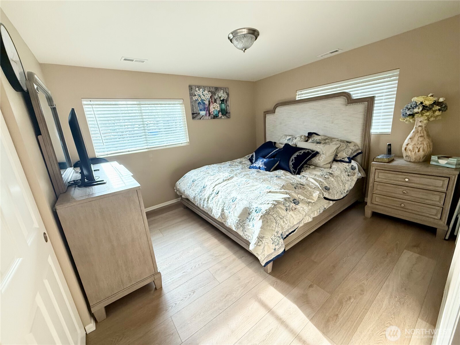 11049 18th Avenue Southwest Seattle, WA 98146 - Photo 15 of 40 a bedroom with a bed and a window