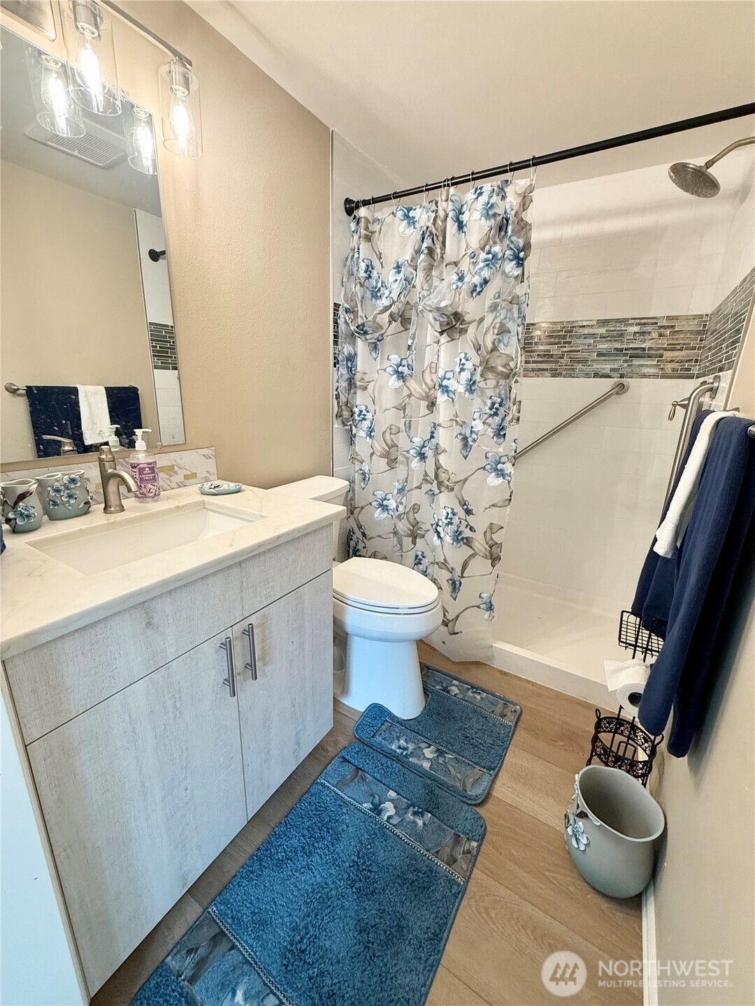11049 18th Avenue Southwest Seattle, WA 98146 - Photo 17 of 40 a bathroom with a sink toilet and shower