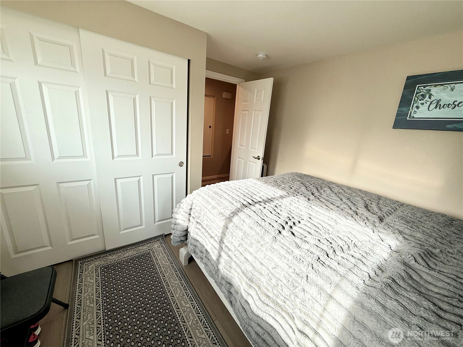11049 18th Avenue Southwest Seattle, WA 98146 - Photo 20 of 40 a bedroom with a bed and cabinets