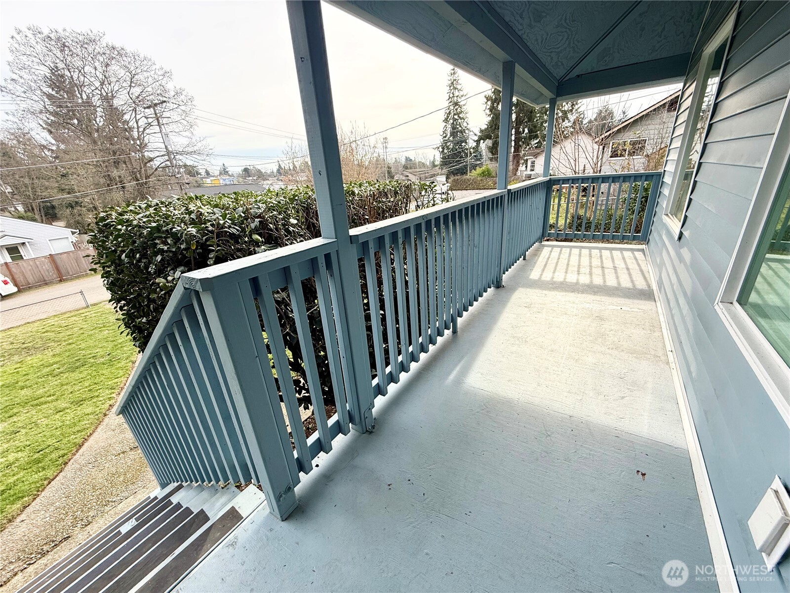 11049 18th Avenue Southwest Seattle, WA 98146 - Photo 2 of 40 a view of balcony with wooden floor and fence