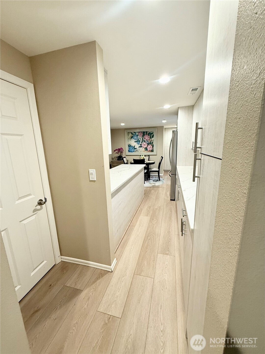 11049 18th Avenue Southwest Seattle, WA 98146 - Photo 6 of 40 a view of a kitchen from a hallway