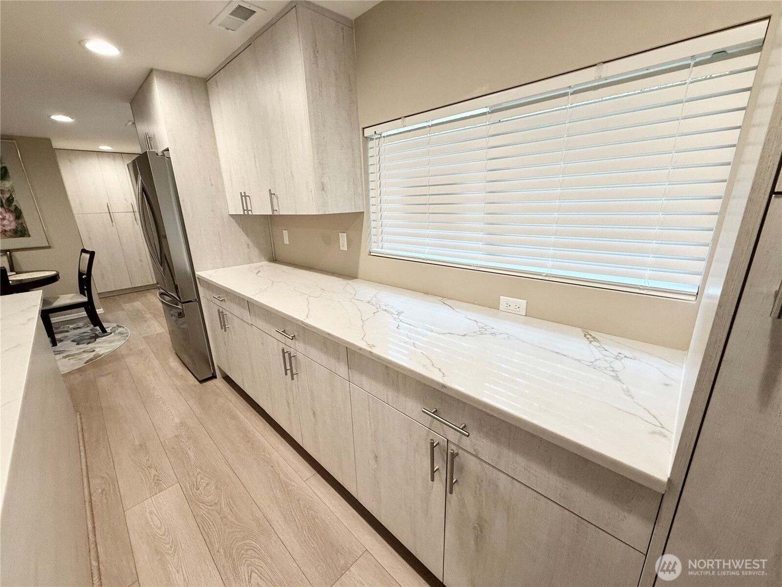 11049 18th Avenue Southwest Seattle, WA 98146 - Photo 7 of 40 a spacious bathroom with a granite countertop sink and a mirror