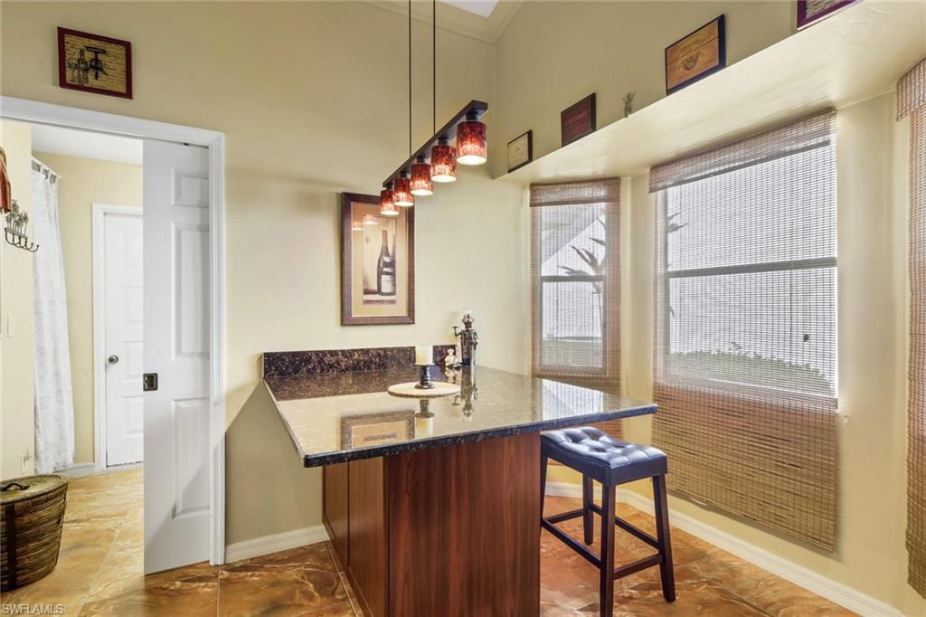 478 Countryside Drive Naples, FL 34104 - Photo 17 of 46 a bathroom with a sink mirror and a bathtub