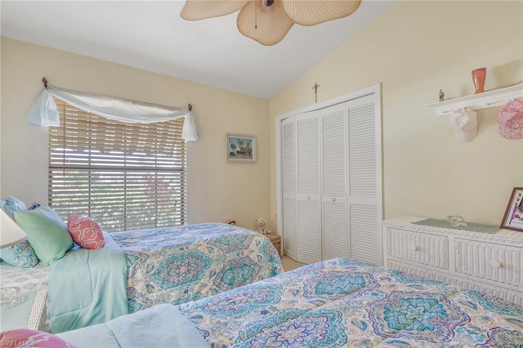 478 Countryside Drive Naples, FL 34104 - Photo 20 of 46 a bedroom with a bed and a window