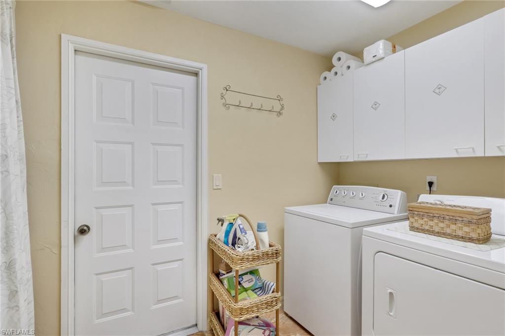 478 Countryside Drive Naples, FL 34104 - Photo 27 of 46 a utility room with dryer and washer