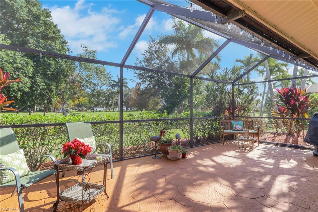478 Countryside Drive Naples, FL 34104 - Photo 30 of 46 a view of a chairs and table in the patio