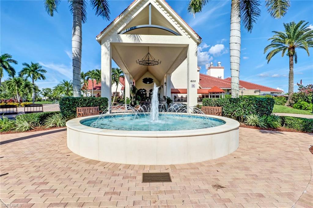 478 Countryside Drive Naples, FL 34104 - Photo 33 of 46 a view of a white house with a small yard and plants