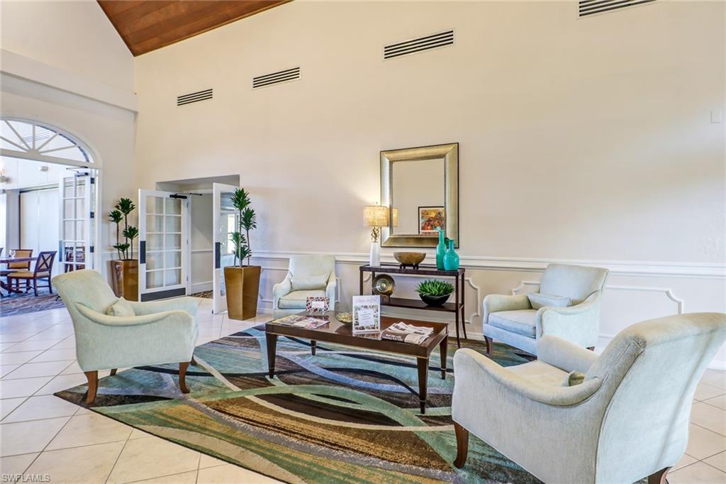 478 Countryside Drive Naples, FL 34104 - Photo 34 of 46 a living room with furniture and a rug