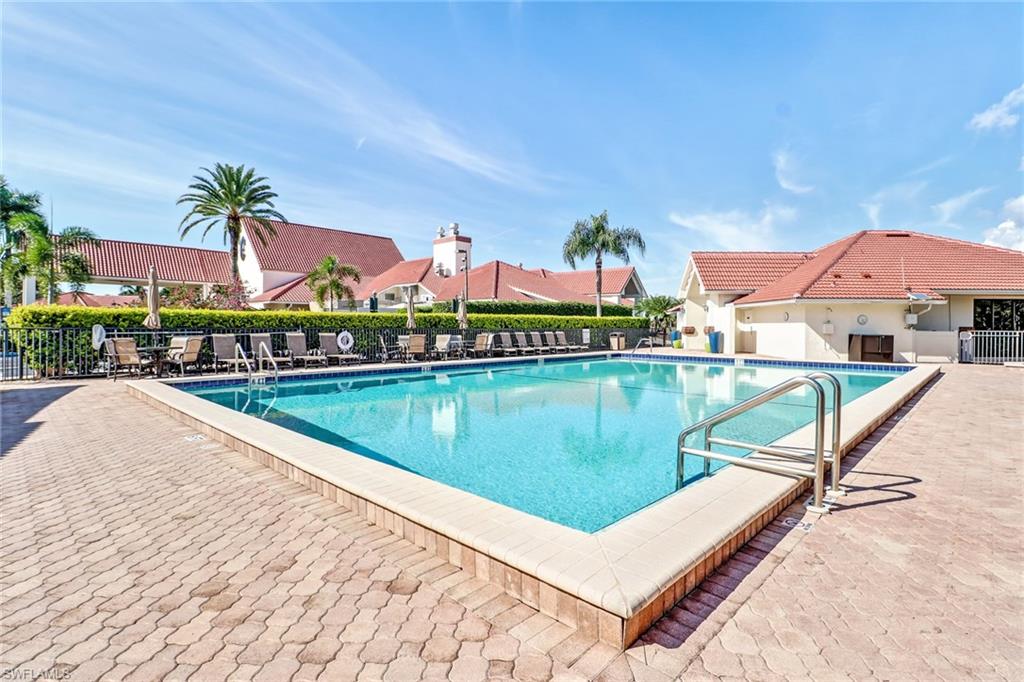 478 Countryside Drive Naples, FL 34104 - Photo 39 of 46 a view of a swimming pool and lounge chairs