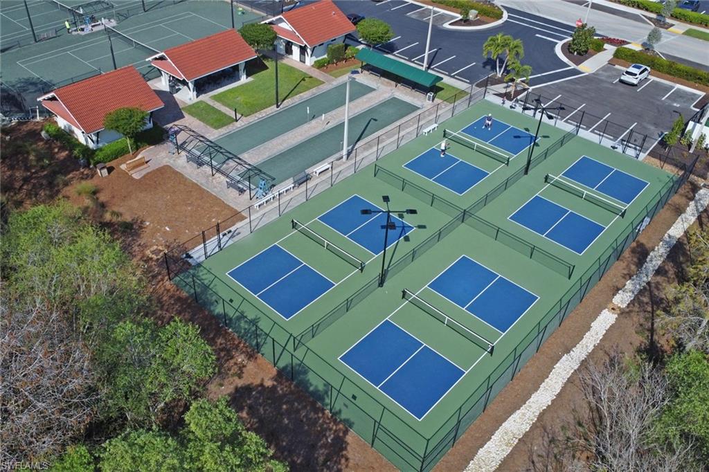 478 Countryside Drive Naples, FL 34104 - Photo 40 of 46 an aerial view of a tennis ground with a city view