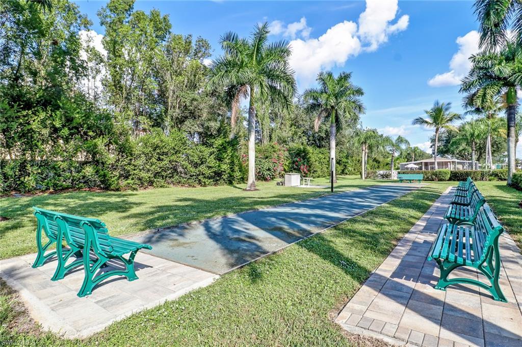 478 Countryside Drive Naples, FL 34104 - Photo 44 of 46 a view of a park with plants and trees