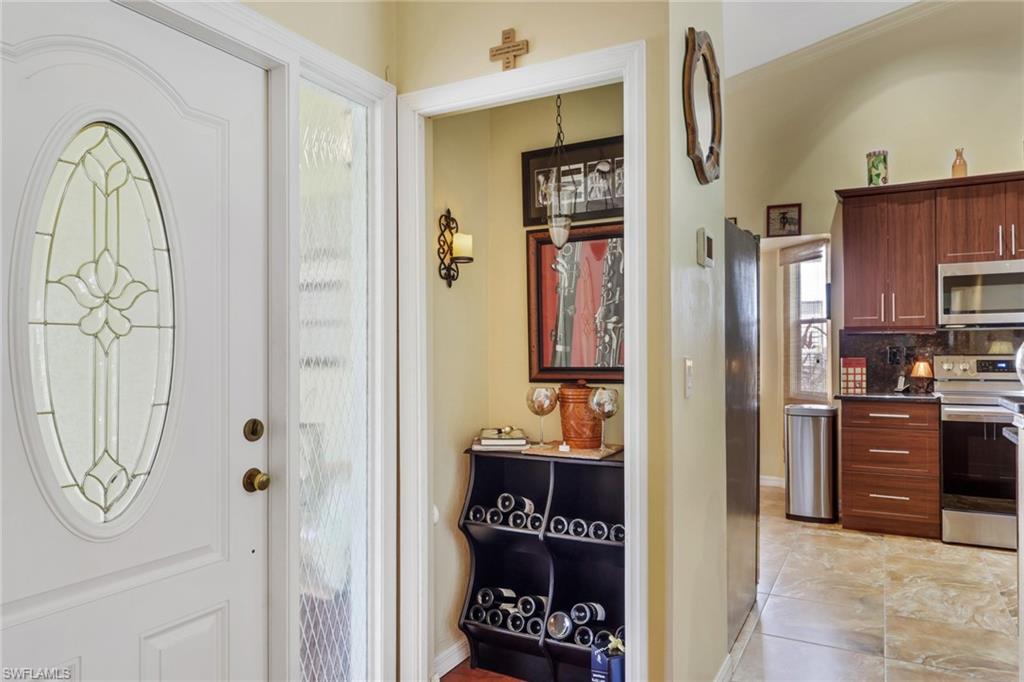 478 Countryside Drive Naples, FL 34104 - Photo 5 of 46 a view of living room and kitchen