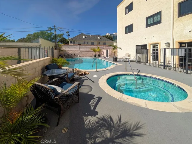 a view of a swimming pool with a lounge chair