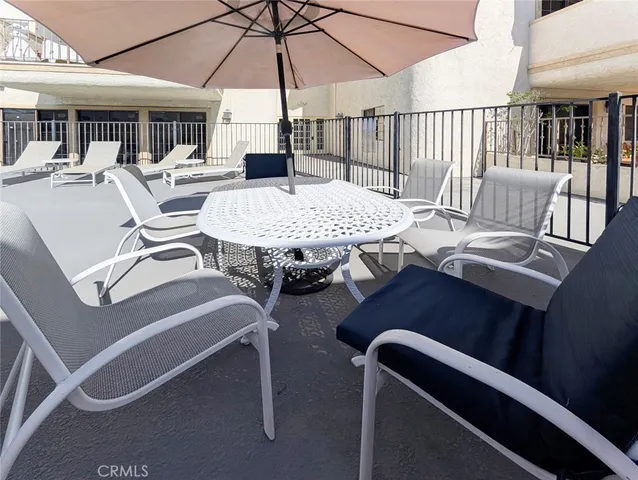 a view of a house with potted plants