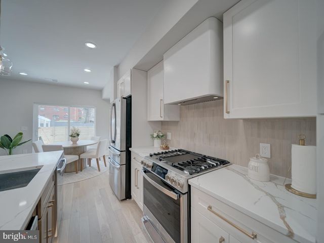 a view of a dining room with furniture and window