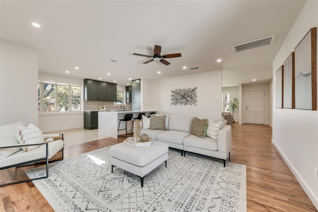 3106 Sharpview Lane Dallas, TX 75228 - Photo 11 of 31 a living room with furniture a fireplace and a flat screen tv