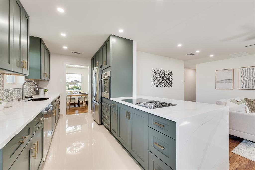 3106 Sharpview Lane Dallas, TX 75228 - Photo 31 of 31 a kitchen with stainless steel appliances granite countertop a sink stove and refrigerator