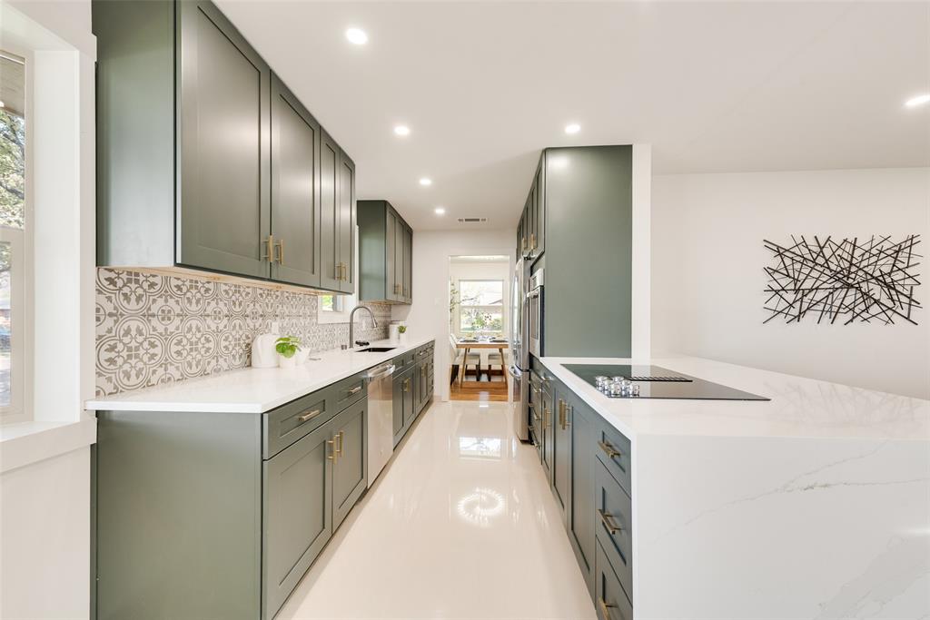 3106 Sharpview Lane Dallas, TX 75228 - Photo 14 of 31 a kitchen with stainless steel appliances a sink and a stove