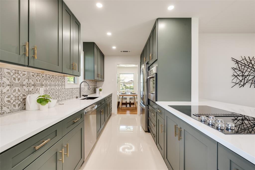 3106 Sharpview Lane Dallas, TX 75228 - Photo 15 of 31 a kitchen with stainless steel appliances granite countertop a sink a stove and a refrigerator