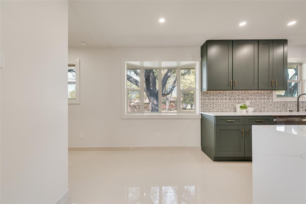 3106 Sharpview Lane Dallas, TX 75228 - Photo 18 of 31 a view of a kitchen with a sink and a window