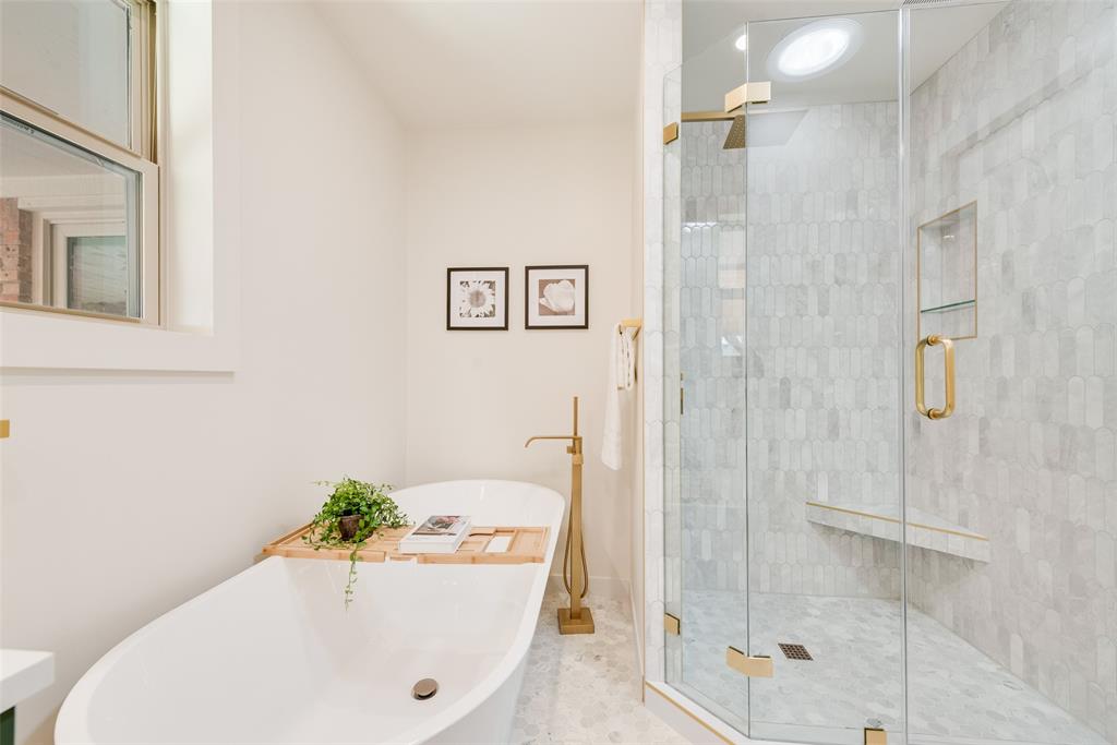 3106 Sharpview Lane Dallas, TX 75228 - Photo 21 of 31 a bathroom with a bathtub and shower