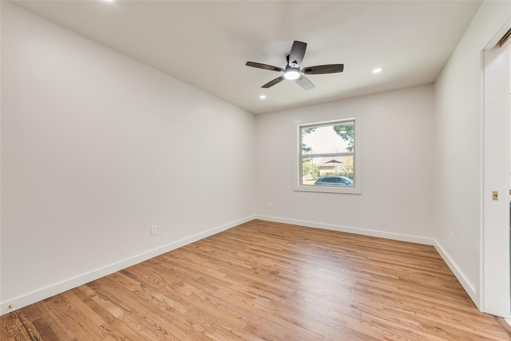 3106 Sharpview Lane Dallas, TX 75228 - Photo 22 of 31 a view of empty room with wooden floor and fan