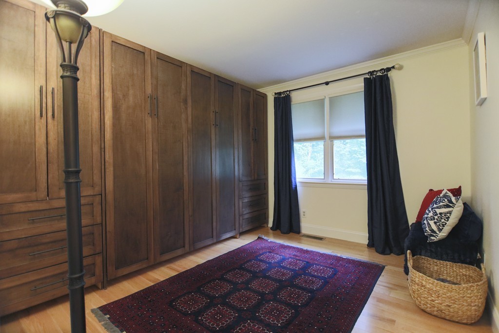 107 Park Road Chelmsford, MA 01824 - Photo 15 of 17 a bedroom with a bed and a window