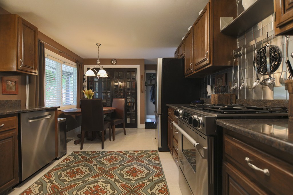 107 Park Road Chelmsford, MA 01824 - Photo 4 of 17 a kitchen with a stove and a refrigerator