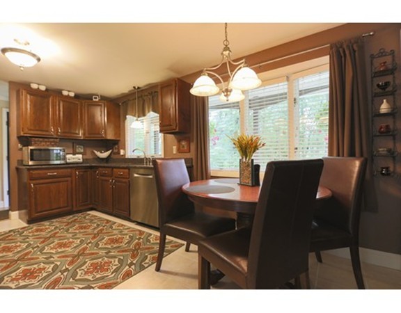 107 Park Road Chelmsford, MA 01824 - Photo 6 of 17 a view of a dining room with furniture window and outside view