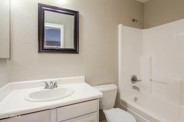 a bathroom with a toilet sink and bathtub