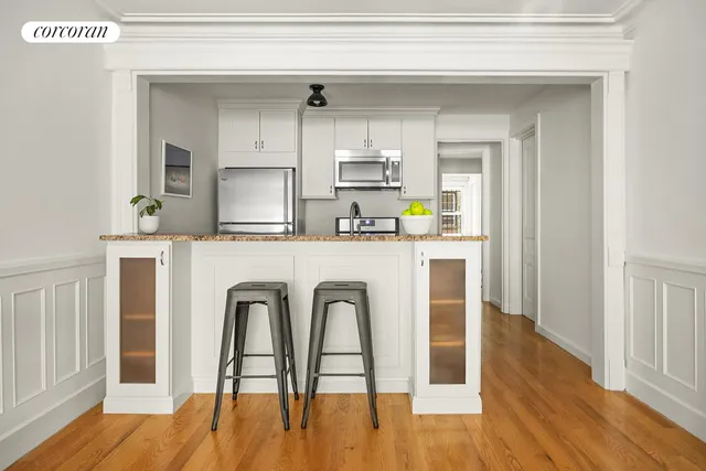 a living room with furniture a fireplace and a table