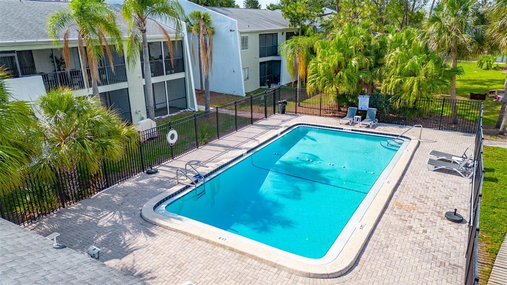13300 Walsingham Road, Unit 56 Largo, FL 33774 - Photo 4 of 35 a view of a house with swimming pool