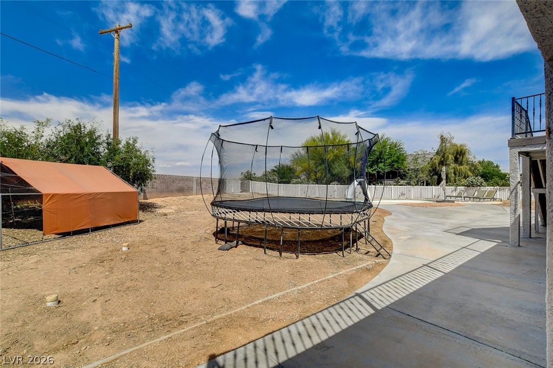 4362 Thistle Street Logandale, NV 89021 - Photo 89 of 99 A spacious backyard area offers a large concrete patio, ideal for outdoor leisure.