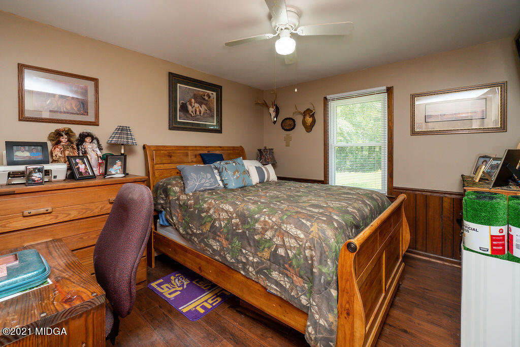 156 Walton Road Fort Valley, GA 31030 - Photo 28 of 61 a bed sitting in a bedroom next to a window