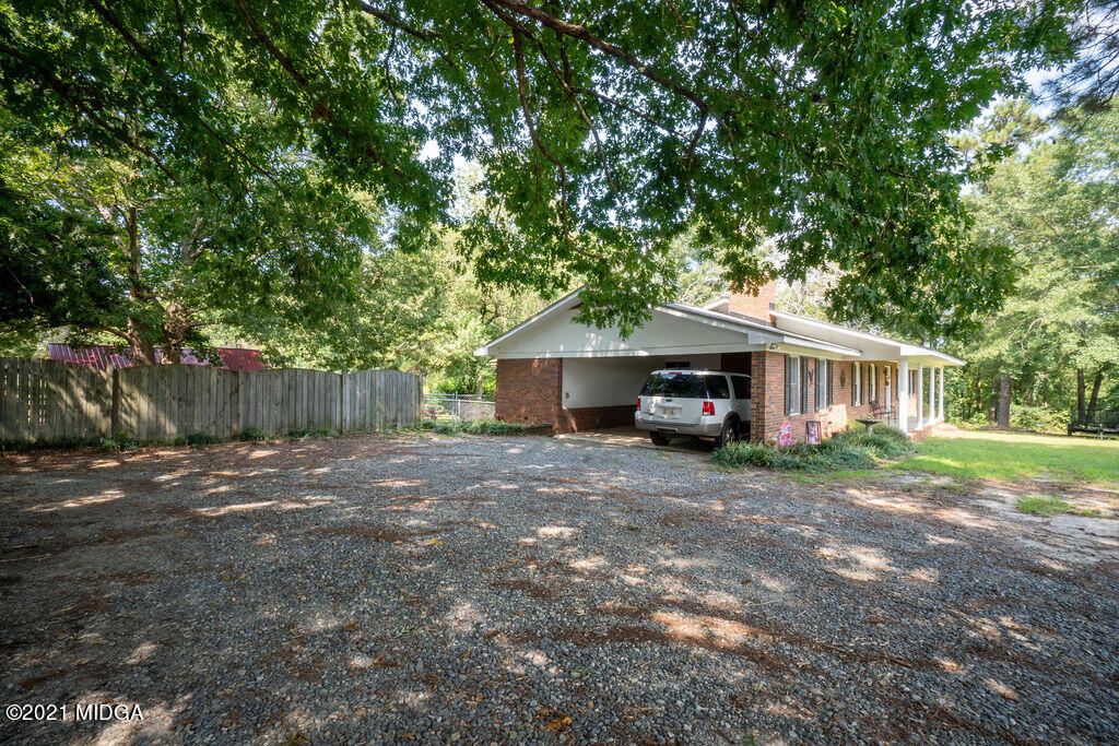 156 Walton Road Fort Valley, GA 31030 - Photo 38 of 61 a front view of a house with a yard and trees
